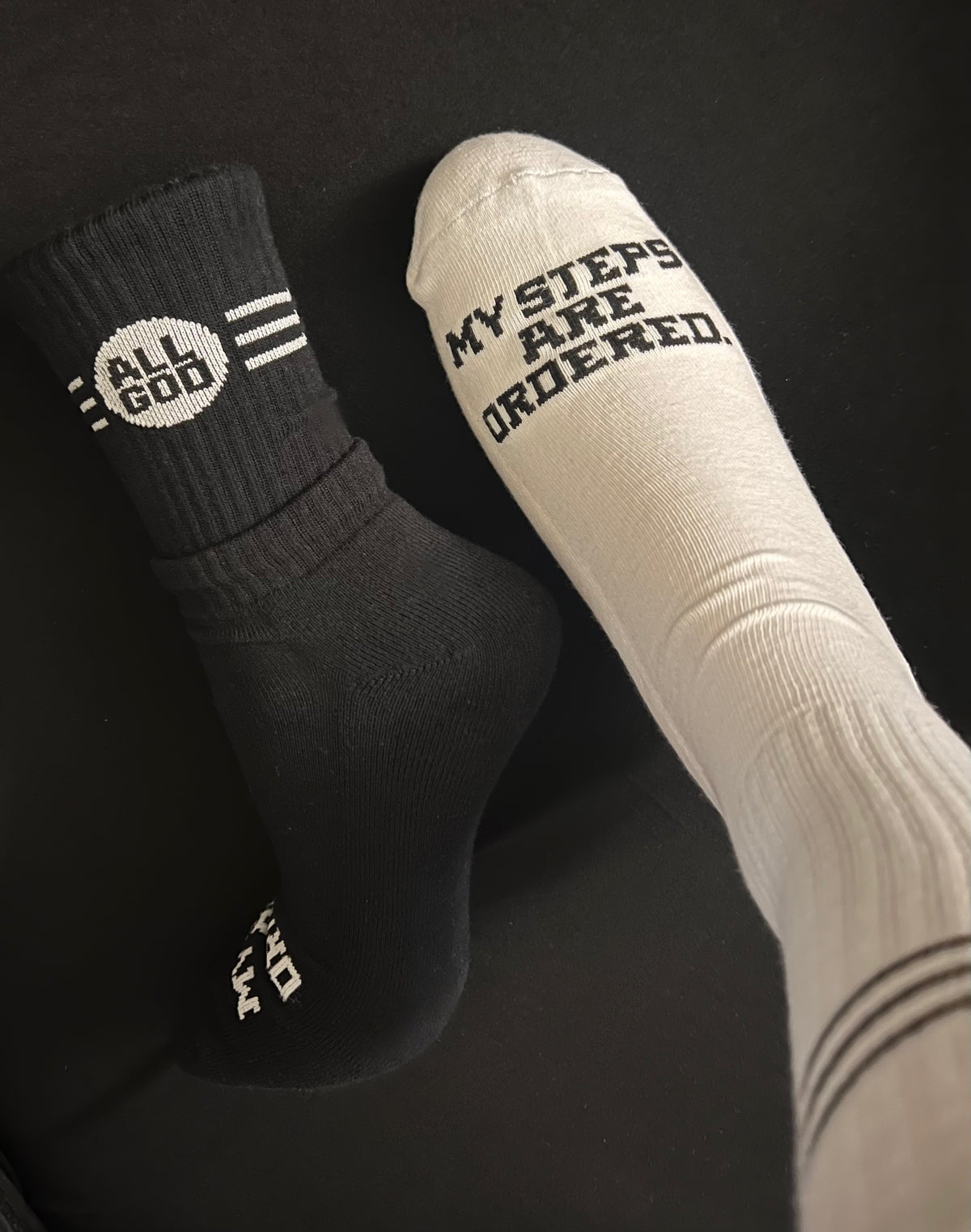 Ordered Steps unisex socks — MY STEPS ARE ORDERED toe text, black pair